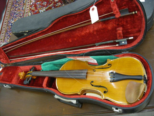 One lot comprising two nice old violins was a surprise hit of the sale, rising to $3,100.